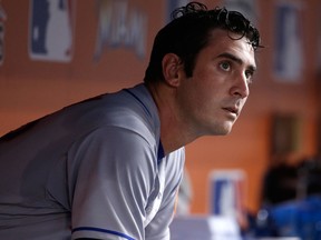 In this Sept. 18, 2017, file photo, New York Mets starting pitcher Matt Harvey sits in the dugout after pitching during the third inning of a baseball game against the Miami Marlins in Miami