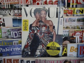 May Vogue Italia cover hits a newsstand in Milan, Italy, Friday, May 4, 2018. Gigi Hadid and Vogue Italia have separately apologized for the May Vogue Italia cover showing the top model with a darker skin tone and hair color that set off a social media backlash and underlined the lack of diversity in the fashion industry. The cover shot by Steven Klein shows the normally blonde Hadid with dark hair and heavily bronzed skin, wearing matching a Dolce & Gabbana sequined legging ensemble with matching tiara. Inside, Hadid poses in beachwear in the spread titled ''High Voltage.''