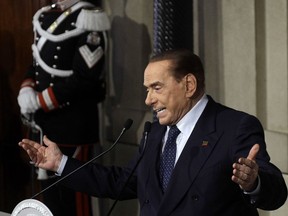 In this file photo dated Thursday, April 12, 2018, Forza Italia party's leader Silvio Berlusconi addresses journalists at the Quirinale presidential palace in Rome.