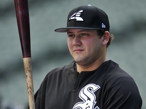 In this June 26, 2017, file photo, Chicago White Sox prospect Jake Burger watches during batting practice in Chicago. (AP Photo/Paul Beaty, File)