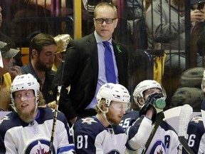 Winnipeg Jets head coach Paul Maurice, top center, watches the third period in Game 1 of an NHL hockey second-round playoff series against the Nashville Predators, Friday, April 27, 2018, in Nashville, Tenn.