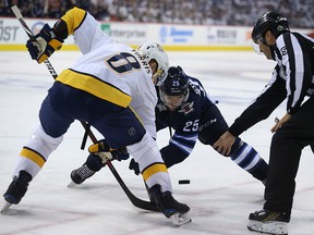 Winnipeg Jets centre Paul Stastny (right) and Nashville Predators centre Kyle Turris face-off during Game 6 of their NHL playoff series in Winnipeg on Mon., May 7, 2018. Kevin King/Winnipeg Sun/Postmedia Network