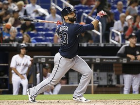 In this May 10, 2018, file photo, Atlanta Braves' Jose Bautista bats against the Miami Marlins in Miami. (AP Photo/Wilfredo Lee, File)