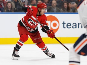 Edmonton's Adam Larsson (6) watches as Carolina's Marcus Kruger (16) passes the puck during the second period of a preseason NHL game between the Edmonton Oilers and the Carolina Hurricanes at Rogers Place in Edmonton, Alberta on Monday, September 25, 2017. Ian Kucerak / Postmedia Photos for copy in Tuesday, Sept. 26 edition.