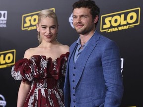 Emilia Clarke, left, and Alden Ehrenreich arrive at the premiere of "Solo: A Star Wars Story" at El Capitan Theatre on Thursday, May 10, 2018, in Los Angeles.