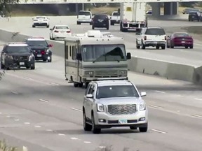 In this frame Tuesday, May 1, 2018 video provided by 23-ABC-TV Bakersfield, police chase an RV along a north bound highway in Kern County, Calif. (23-ABC-TV Bakersfield via AP)