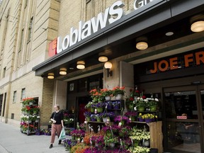 A women leaves a Loblaws store in Toronto on Thursday, May 3, 2018.
