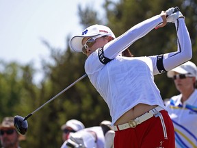 Jin-Young Ko, of South Korea, watches her tee shot on the first hole during the LPGA tour Volunteers of America Texas Shootout golf tournament in The Colony, Texas, Sunday, May 6, 2018.