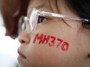 In this photo taken March 3, 2018, a girl has her face painted during the Day of Remembrance for MH370 event in Kuala Lumpur, Malaysia.