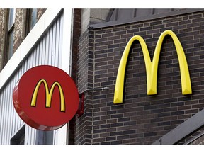 In this April 24, 2017, file photo, corporate signage hangs at a McDonald's restaurant in downtown Pittsburgh.