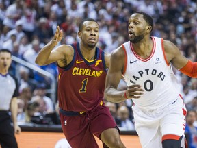 Toronto Raptors C.J. Miles (right) tries to get past Cleveland Cavaliers’ Rodney Hood during Game 1 of their series last night. (Ernest Doroszuk/Toronto Sun)