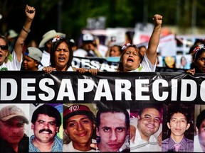 Activists, relatives and mothers of missing people march to demand answers from the Mexican government about their loved ones whereabouts, as part of the commemoration of Mothers' Day in Mexico City on Thursday, May 10, 2018.