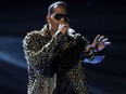 In this June 30, 2013, file photo, R. Kelly performs onstage at the BET Awards at the Nokia Theatre in Los Angeles. Streaming numbers for R. Kelly has remained intact a week after Spotify announced it had removed the R&B singer's music from its playlists, citing its new policy on hate content and hateful conduct.