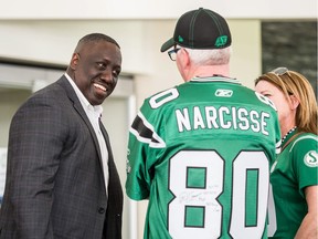 Former Saskatchewan Roughriders receiver Don Narcisse chats with fans Saturday night at Capital GMC.