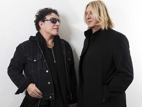 In this Jan. 23, 2018 photo, Journey lead guitarist Neal Schon, left, and Def Leppard singer Joe Elliot appear in New York to promote their 60-show tour this summer. While both bands have continued to make new music, expect the tour to focus on the hits.
