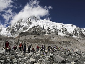 FILE - In this Sept. 27, 2015 file photo, trekkers rest at Everest Base Camp, Nepal. (AP Photo/Tashi Sherpa, File)