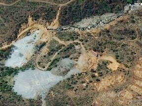 FILE - This May 7, 2018, satellite images provided by DigitalGlobe shows the nuclear test site in Punggye-ri, North Korea. North Korea has carried out what it says is the demolition of its nuclear test site in the presence of foreign journalists. The demolition happened Thursday at the site deep in the mountains of the North's sparsely populated northeast. The planned closing was previously announced by leader Kim Jong Un ahead of his planned summit with U.S. President Donald Trump next month. (Satellite Image ©2018 DigitalGlobe, a Maxar company via A, File)