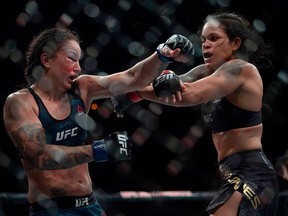 Brazilian fighter Amanda Nunes (R) competes against US fighter Raquel Pennington (L) during their women's bantamweight title fight at the Ultimate Fighting Championship 224 (UFC 224) event at Jeunesse Arena in Rio de Janeiro on May 12, 2018.