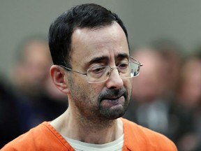 In this Nov. 22, 2017 file photo, Dr. Larry Nassar, 54, appears in court for a plea hearing in Lansing, Mich.