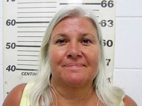 This file photo provided by the South Padre Island Police Department shows Lois Riess, of Blooming Prairie, Minn., who was arrested by federal deputy marshals April 19, 2018, at a restaurant in South Padre Island, Texas in connection with the killings of two people in separate states, including her husband.