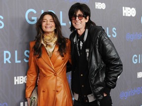 FILE - In this Jan. 9, 2013, file photo, Musician Ric Ocasek and wife model Paulina Porizkova attend the HBO premiere of "Girls" at the NYU Skirball Center in New York. Porizkova and rocker Ric Ocasek have separated after 28 years of marriage. Porizkova announced on Instagram on Wednesday, May 2, 2018, they have not been a couple "for the past year."