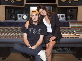In this May 4, 2018 photo, Deacon Frey, son of the late Eagles co-founder Glenn Frey, left, and his mother Cindy Frey pose for a portrait at Dog House Recording Studio in Los Angeles. Deacon Frey is keeping his dad's legacy alive by touring and performing with the Eagles. Cindy Frey, is the executor of her husband's estate.