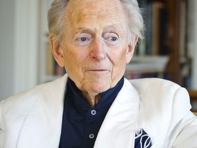 FILE - In this July 26, 2016 file photo, American author and journalist Tom Wolfe, Jr. appears in his living room during an interview about his latest book, "The Kingdom of Speech," in New York. Wolfe died at a New York City hospital. He was 87. Additional details were not immediately available.