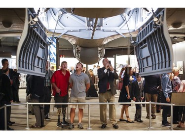 Visitors gather under open bomb-bay doors during a private viewing of the Memphis Belle, a Boeing B-17 "Flying Fortress," at the National Museum of the U.S. Air Force, Wednesday, May 16, 2018, in Dayton, Ohio.