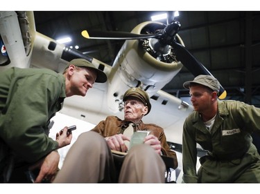 United States Air Force (Ret.) Col. Howard Hunt, center, meets with Memphis Belle fans during the private viewing of the Boeing B-17 "Flying Fortress" at the National Museum of the U.S. Air Force, Wednesday, May 16, 2018, in Dayton, Ohio.