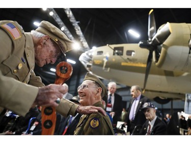 Veterans gather for a private viewing of the Memphis Belle, a Boeing B-17 "Flying Fortress," at the National Museum of the U.S. Air Force, Wednesday, May 16, 2018, in Dayton, Ohio.