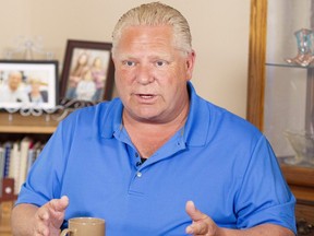 Ontario Progressive Conservative Leader Doug Ford at a campaign stop in the kitchen of Bill and Linda Reid in Reeces Corners, Ont. on Wednesday.