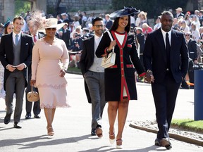 Idris Elba and Sabrina Dhowre followed by Oprah Winfrey (fourth right) arrive at St George's Chapel at Windsor Castle for the wedding of Meghan Markle and Prince Harry on May 19, 2018 in Windsor, England. (Chris Radburn - WPA Pool/Getty Images)
