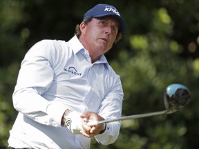 Phil Mickelson watches his shot from the 11th tee during the first round of The Players Championship Thursday, May 10, 2018, in Ponte Vedra Beach, Fla. (AP Photo/Lynne Sladky)