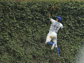 Kevin Pillar of the Blue Jays fields a fly ball off the wall at Wrigley Field on August 20, 2017 in Chicago. (Stacy Revere/Getty Images)
