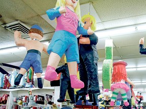 In this Feb. 22, 2016 photo, Donald Trump pinatas hang from the ceiling among more traditional ones at El Paisano in Santa Fe, N.M. (Luis Sanchez Saturno/The New Mexican via AP)
