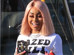 Blac Chyna gets into her white Ferrari while out and about.