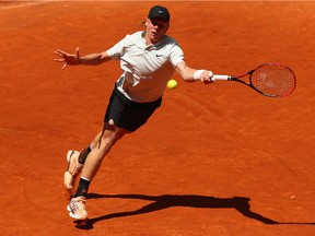 Denis Shapovalov of Canada plays a forehand against Benoit Paire of France in their second round match during Day 4 of the Mutua Madrid Open tennis tournament at the Caja Magica on May 8, 2018