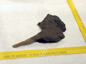 What is believed to be a piece of a leg bone was extracted from a concretion taken from the Whydah pirate ship wreck. The bone was removed Monday, Feb. 19, 2018, during a press conference in West Yarmouth, Mass. DNA testing has determined that the remains are not those of Whydah Captain Samuel Bellamy, or "Black Sam" Bellamy. (Merrily Cassidy /The Cape Cod Times via AP)