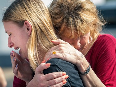 Santa Fe High School student Dakota Shrader is comforted by her mother Susan Davidson following a shooting at the school on Friday, May 18, 2018, in Santa Fe, Texas.