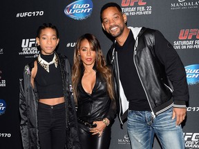 (L-R) Singer/actress Willow Smith, actress/producer Jada Pinkett Smith and actor Will Smith attend the UFC 170 event at the Mandalay Bay Events Center on Feb. 22, 2014 in Las Vegas.