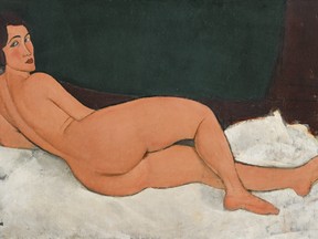 This 1917 oil painting, "Nu couche (sur le cote gauche)" by Amedeo Modigliani, was auctioned at Sotheby's in New York for more than $157 million, in their Impressionist & Modern Art evening sale Monday, May 14, 2018. (Sotheby's via AP)