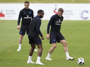 Raheem Sterling visibly showing a tattoo on his leg during a training session at St George's Park Monday May 28, 2018 as the England team prepares for the upcoming World Cup. (Nick Potts/PA via AP)