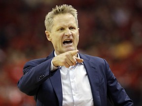 Golden State Warriors head coach Steve Kerr signals during Game 2 of the NBA Western Conference finals against the Houston Rockets, Wednesday, May 16, 2018, in Houston. (AP Photo/David J. Phillip)