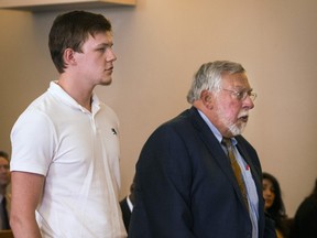 Ryan Fish stands with his  lawyer, Paul Chinigo, in Norwich Superior Court on Tuesday, May 8, 2018 in Norwich, Conn.  (Melanie Stengel/Hartford Courant via AP)