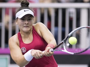 Bianca Andreescu of Canada returns to Lesia Tsurenko of Ukraine during their Fed Cup tennis match in Montreal, Saturday, April 21, 2018. (The Canadian Press/Graham Hughes)