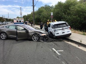 Laguna Beach Police tweeted this photo of a Tesla sedan that crashed into a parked police cruiser. (Laguna Beach Police/Twitter)