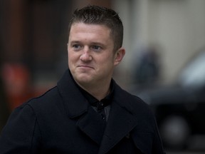 In this Wednesday, Oct. 16, 2013 file photo, Tommy Robinson the former leader of the far-right EDL "English Defence League" group arrives for an appearance at Westminster Magistrates Court in London. (AP)