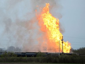 Flames erupt as an ethanol fire rages at the Norfolk Southern rail yard, Saturday, May 5, 2018, in Bellevue, Ohio. (Jilly Burns/The Sandusky Register via AP)