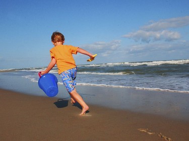 This undated photo provided by VisitNC.com shows a boy on the beach at Ocracoke on the Outer Banks of North Carolina. The Ocracoke Lifeguarded Beach is No. 2 on the list of best beaches for the summer of 2018 compiled by Stephen Leatherman, also known as Dr. Beach, a professor at Florida International University.