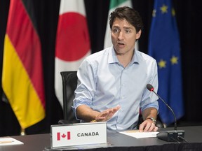 Prime Minister Justin Trudeau meets with G7 Sherpas, in preparation for the summit, Thursday, May 24, 2018 in Baie-St-Paul, Que. THE CANADIAN PRESS/Jacques Boissinot